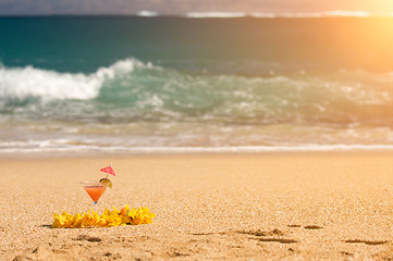 Image showing Tropical Drink and Lei on Beach Shoreline