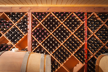 Image showing Wine Barrels and Bottles Age Inside Cellar