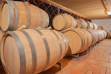 Image showing Wine Barrels and Bottles Age Inside Cellar