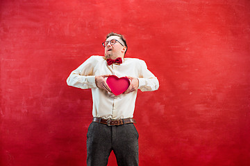 Image showing Young funny man with abstract heart