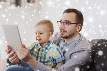 Image showing father and son with tablet pc playing at home