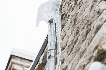 Image showing icicles hanging from building drainpipe