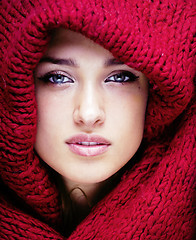 Image showing young pretty woman in sweater and scarf all over her face, lifestyle winter people concept