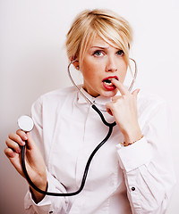 Image showing funny doctor with stethoscope, smiling blond woman medical equipment showing on white background
