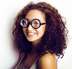 Image showing teenage bookworm concept, cute young woman in glasses, lifestyle people concept