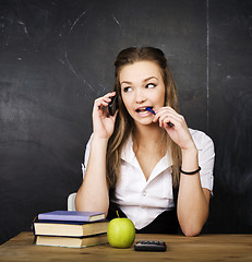 Image showing portrait of happy cute student with book in classroom