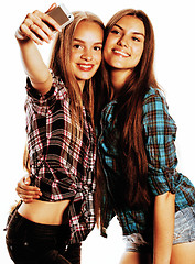 Image showing cute teenage girls making selfie isolated