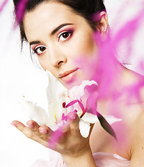 Image showing beauty young brunette woman with flower close up, rose petails spa