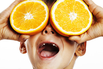 Image showing little cute boy with orange fruit double isolated on white smili