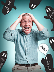 Image showing The disappointed young man over blue background