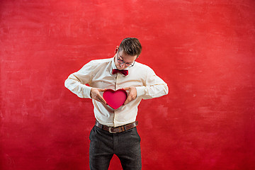 Image showing Young funny man with abstract heart