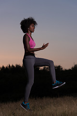 Image showing black woman is doing stretching exercise relaxing and warm up