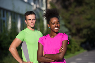 Image showing portrait of young multietnic jogging couple ready to run