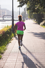 Image showing african american woman jogging in the city