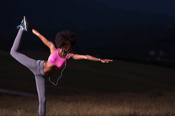 Image showing black woman doing yoga  in the nature