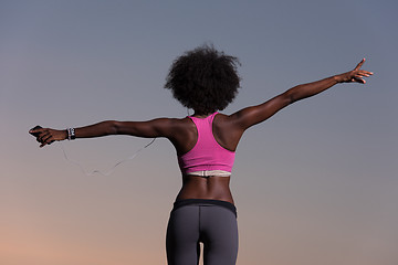 Image showing young black girl dances outdoors