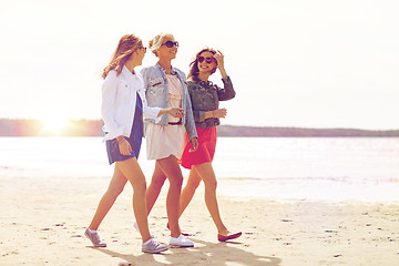 Image showing group of smiling women in sunglasses on beach