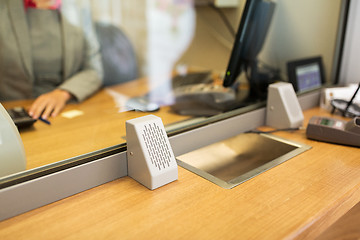 Image showing clerk at bank office or currency exchanger