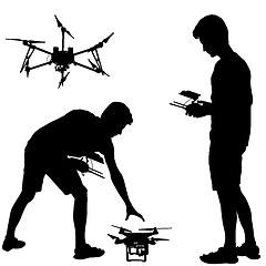 Image showing Black silhouette of a man operates unmanned quadcopter illustration