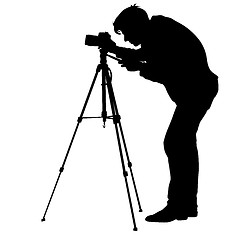 Image showing Cameraman with video camera. Silhouettes on white background. illustration