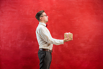 Image showing Young funny man with gift