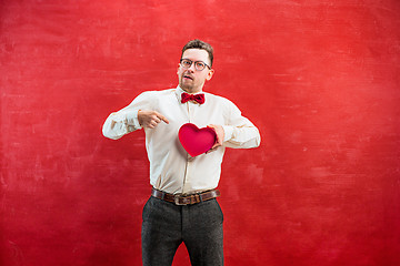 Image showing Young funny man with abstract heart