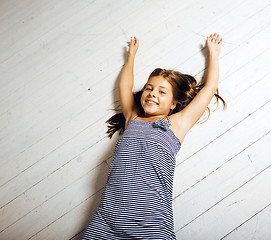 Image showing little cute brunette girl at home interior happy smiling close up