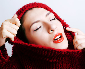 Image showing young pretty woman in sweater and scarf all over her face, lifes