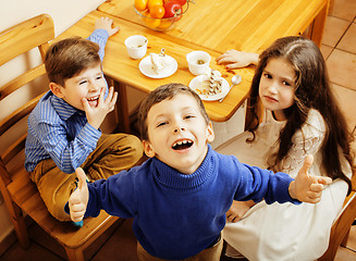 Image showing little cute boys eating dessert on wooden kitchen. home interior. smiling adorable friendship together forever friends, lifestyle people concept