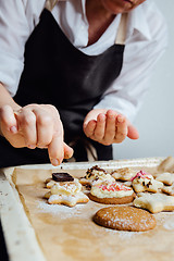 Image showing Person finishing homemade cookies