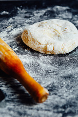 Image showing Dough and rolling pin