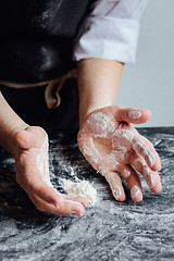 Image showing Cook picking odd flour