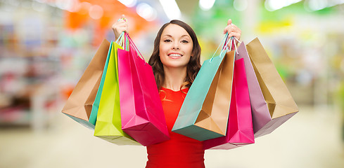 Image showing woman with shopping bags at store