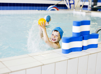 Image showing little cute real boy in swimming pool close up smiling, lifestyle sport people concept