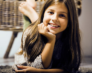 Image showing little cute brunette girl at home interior happy smiling close u