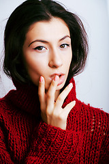 Image showing young pretty woman in sweater and scarf all over her face, lifes