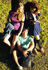 Image showing cute group of teenages at the building of university with books 