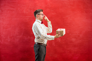 Image showing Young funny man with gift