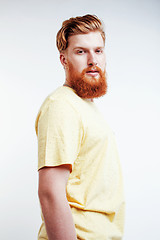 Image showing young handsome hipster ginger bearded guy looking brutal isolated on white background, lifestyle people concept