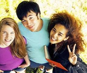 Image showing cute group of teenages at the building of university with books 