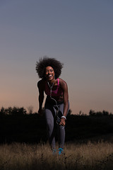 Image showing black woman is doing stretching exercise relaxing and warm up