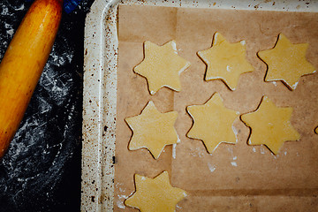 Image showing Star-shaped cookies on a baking pan