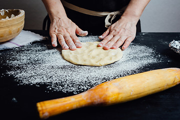 Image showing Chef rolling cookie dough