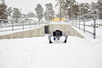 Image showing couple doing push-ups outdoors