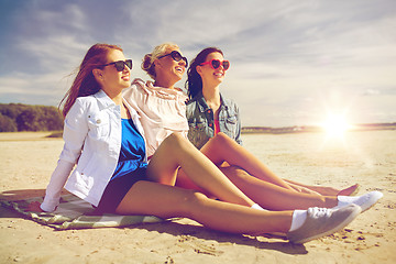 Image showing group of smiling women in sunglasses on beach