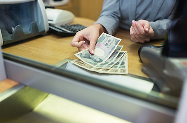 Image showing clerk counting cash money at bank office