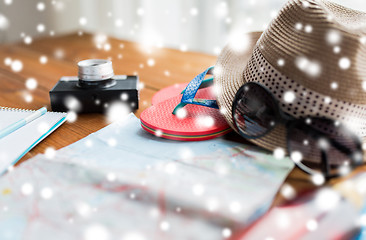 Image showing close up of travel map, flip-flops, hat and camera