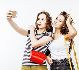 Image showing two best friends teenage girls together having fun, posing emotional on white background, besties happy smiling, lifestyle people concept