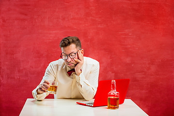 Image showing Young funny man with laptop at St. Valentine\'s Day