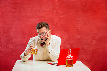 Image showing Young funny man with laptop at St. Valentine\'s Day